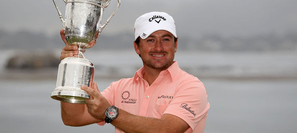 Graeme McDowell lifts the US Open trophy at Pebble Beach