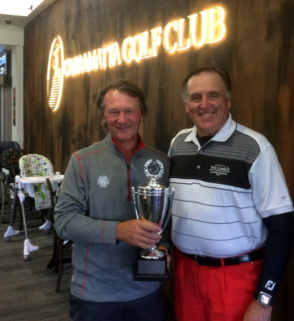 2016 Cabramatta Senior Cup winner Ken Brewer accepts the major trophy from 2015 winner Denis Dale